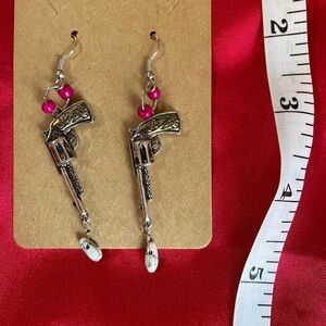 Silver and gold tone gun earrings with pink beads